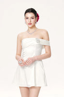 Nana Jacqueline Cornelia white mini dress shown on a model, featuring a stylish, fitted design with elegant short sleeves.
