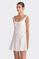 White corset A-line mini dress by Stolen Stores, featuring fitted bodice and flared skirt, perfect for stylish occasions.