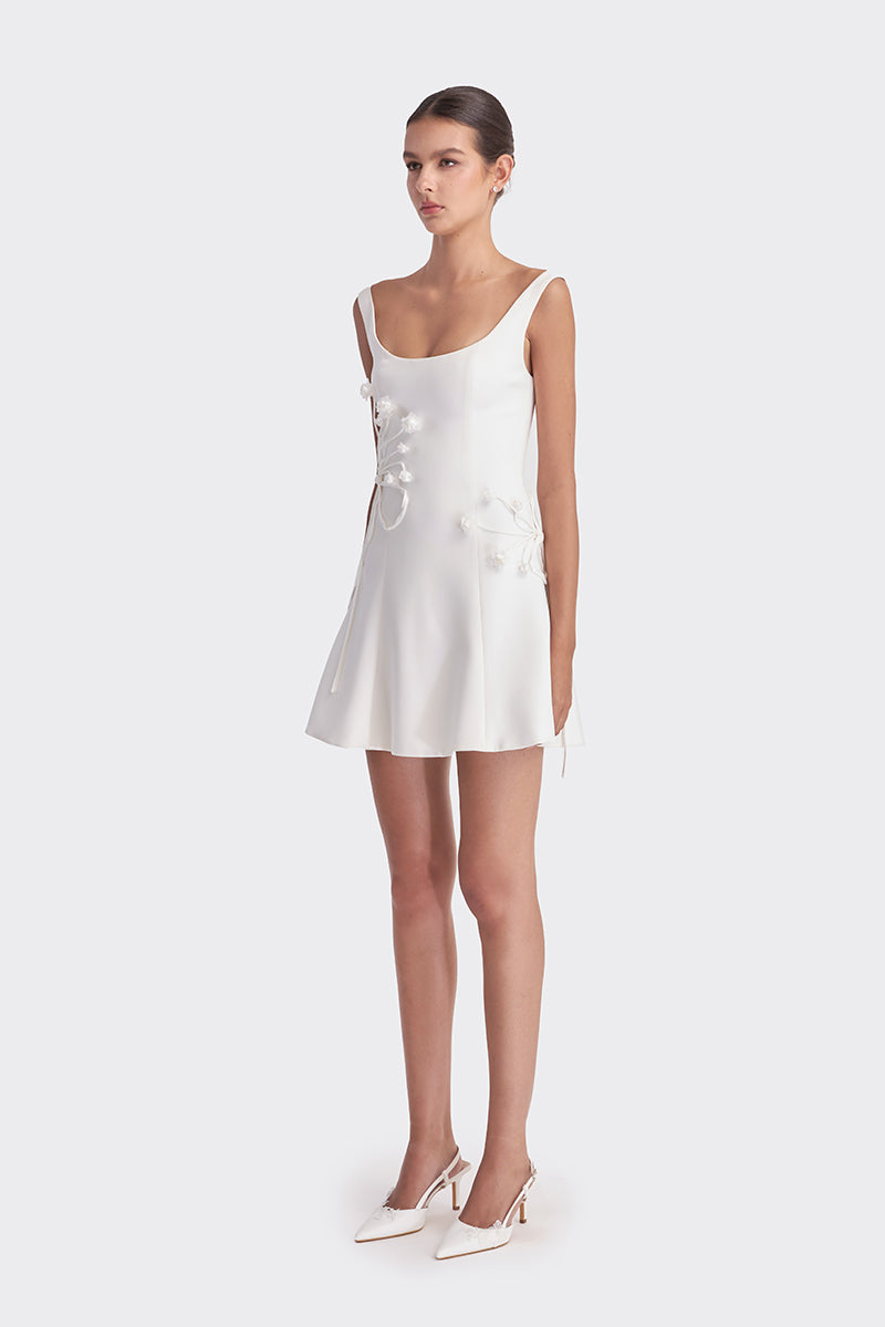 White corset A-line mini dress by Stolen Stores, featuring a fitted bodice and flared skirt, stylish and perfect for casual or evening wear.