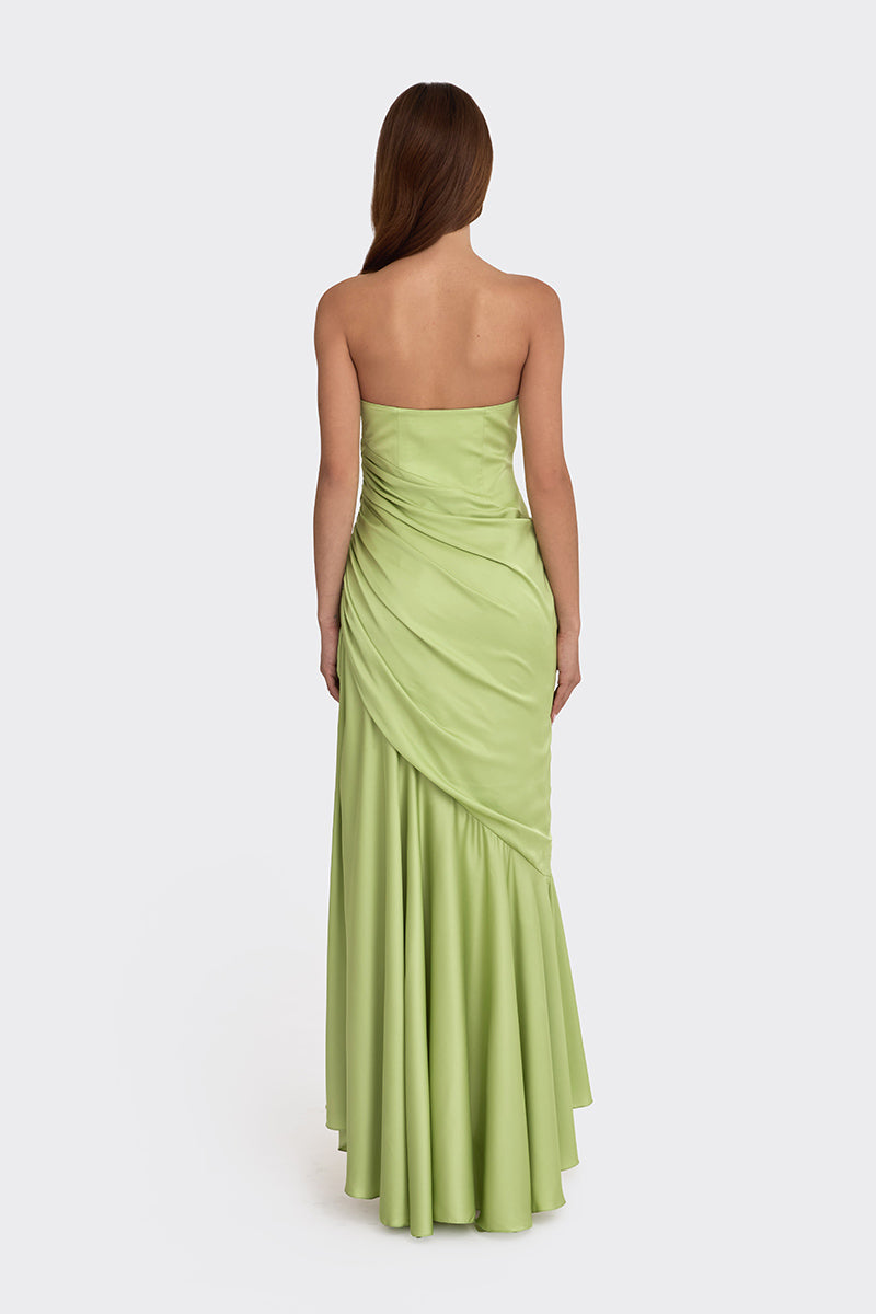 Green corset-draped maxi dress by Stolen Stores, featuring a fitted bodice and flowing skirt.