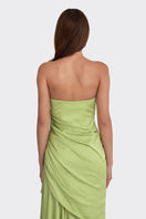 Green corset-draped maxi dress by Stolen Stores, featuring a fitted bodice and flowing skirt in a stylish design.