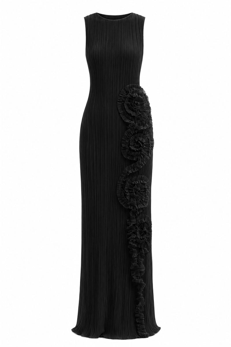 Black Costa Clara maxi dress by Maylé Vásquez, flowing fabric and elegant design, shown on a model.