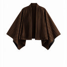 Brown COSTE NORTA jacket by Maylé Vásquez, shown in a stylish view, featuring a tailored design and modern jacket details.