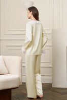 Yellow women's pajama set from MANITO featuring a comfortable, stylish court design with a relaxed fit and soft fabric.
