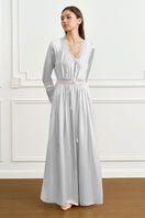 Gray women's silk robe by MANITO, elegant and smooth, shown hanging open with a relaxed fit and luxurious fabric.