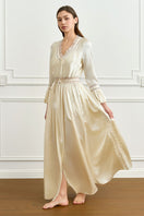 Yellow silk women's robe by MANITO featuring elegant, smooth fabric and relaxed fit, displayed on a hanger.