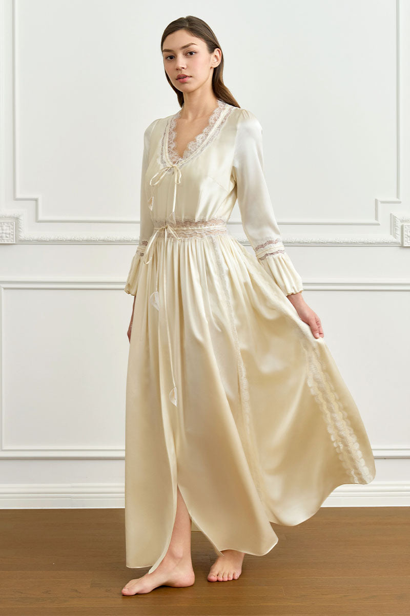 Yellow silk women's robe by MANITO featuring elegant, smooth fabric and relaxed fit, displayed on a hanger.