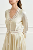 Yellow silk women's robe by MANITO, featuring a luxurious and smooth fabric with a relaxed fit and elegant design.