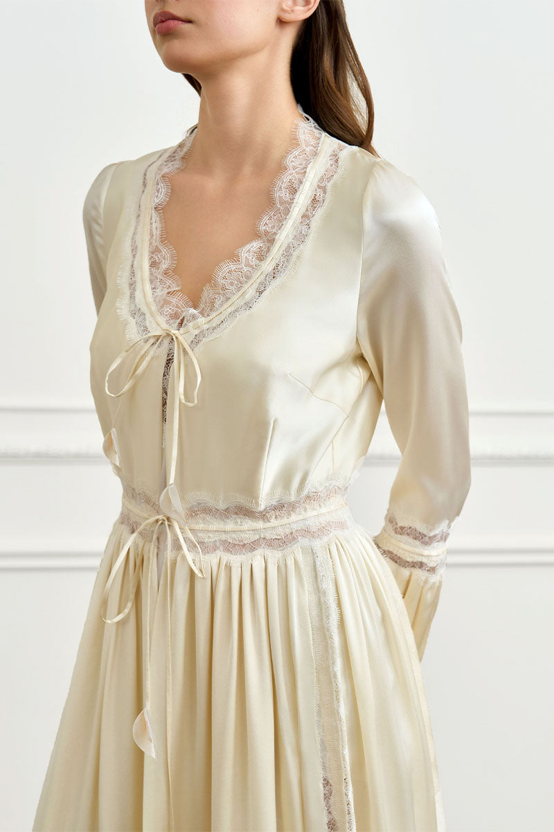 Yellow silk women's robe by MANITO, featuring a luxurious and smooth fabric with a relaxed fit and elegant design.