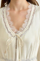 Yellow silk women’s robe by MANITO, featuring a smooth, elegant design perfect for lounging or sleepwear.