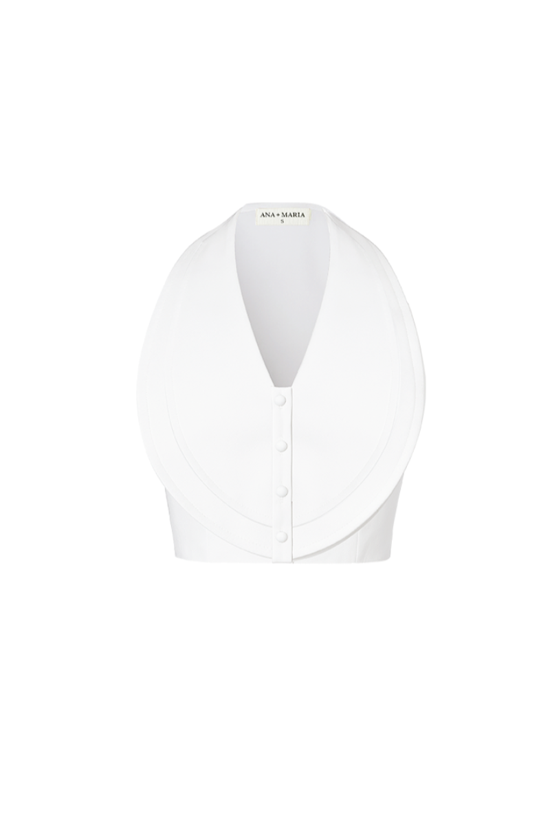 Ivory COVA crop top by ANA + MARIA, shown on a model with a fitted neckline and stylish short sleeves.