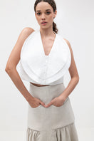 Ivory Cova crop top by ANA + MARIA, featuring a stylish, fitted design and soft fabric, shown on a plain background.