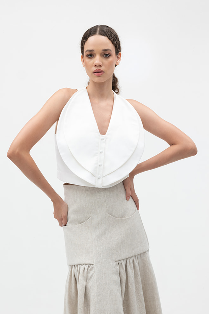 Ivory Cova crop top by ANA + MARIA, showing a fitted, stylish sleeveless tops with a scoop neckline and sleek fabric.