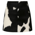 Black and white cowhide mini skirt by ZUT, featuring a sleek, fashionable design with a fitted waist and stylish pattern.