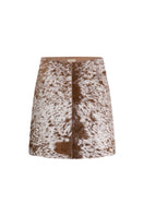 ZUT toffee cowhide mini skirt shown on a model, featuring a stylish, fitted design perfect for casual or dressy outfits.