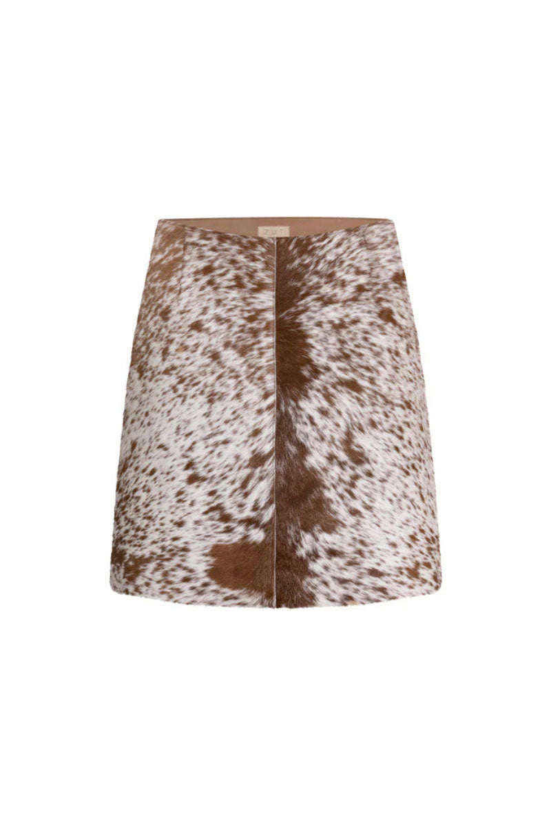 ZUT toffee cowhide mini skirt shown on a model, featuring a stylish, fitted design perfect for casual or dressy outfits.