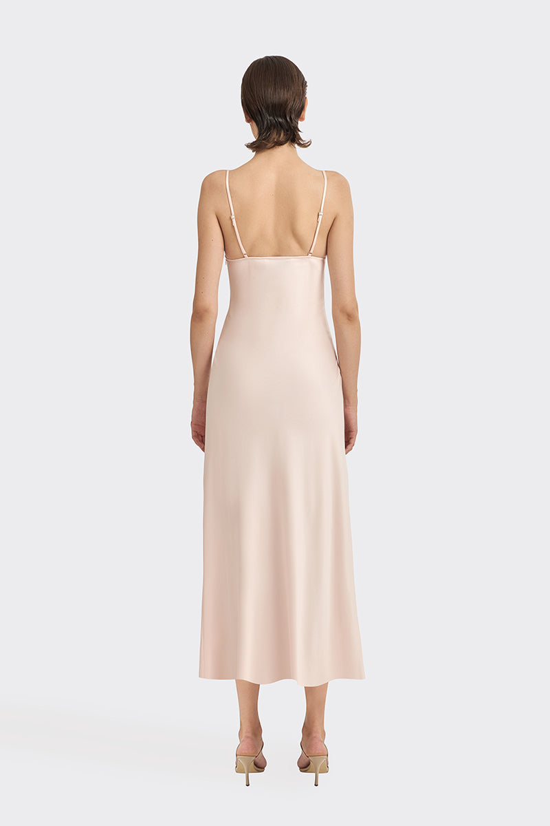Light pink cowl neck lace midi dress by Stolen Stores, displayed on a hanger with elegant drape and delicate fabric details.