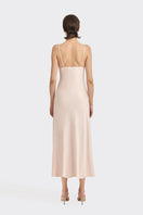 Light pink cowl neck lace midi dress by Stolen Stores, displayed on a hanger with elegant drape and delicate fabric details.