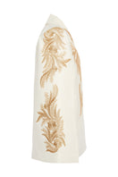 Nadya Shah ALYA ivory tuxedo cape jacket shown from side view, elegant cream tuxedo cape with tailored fit and sophisticated style.