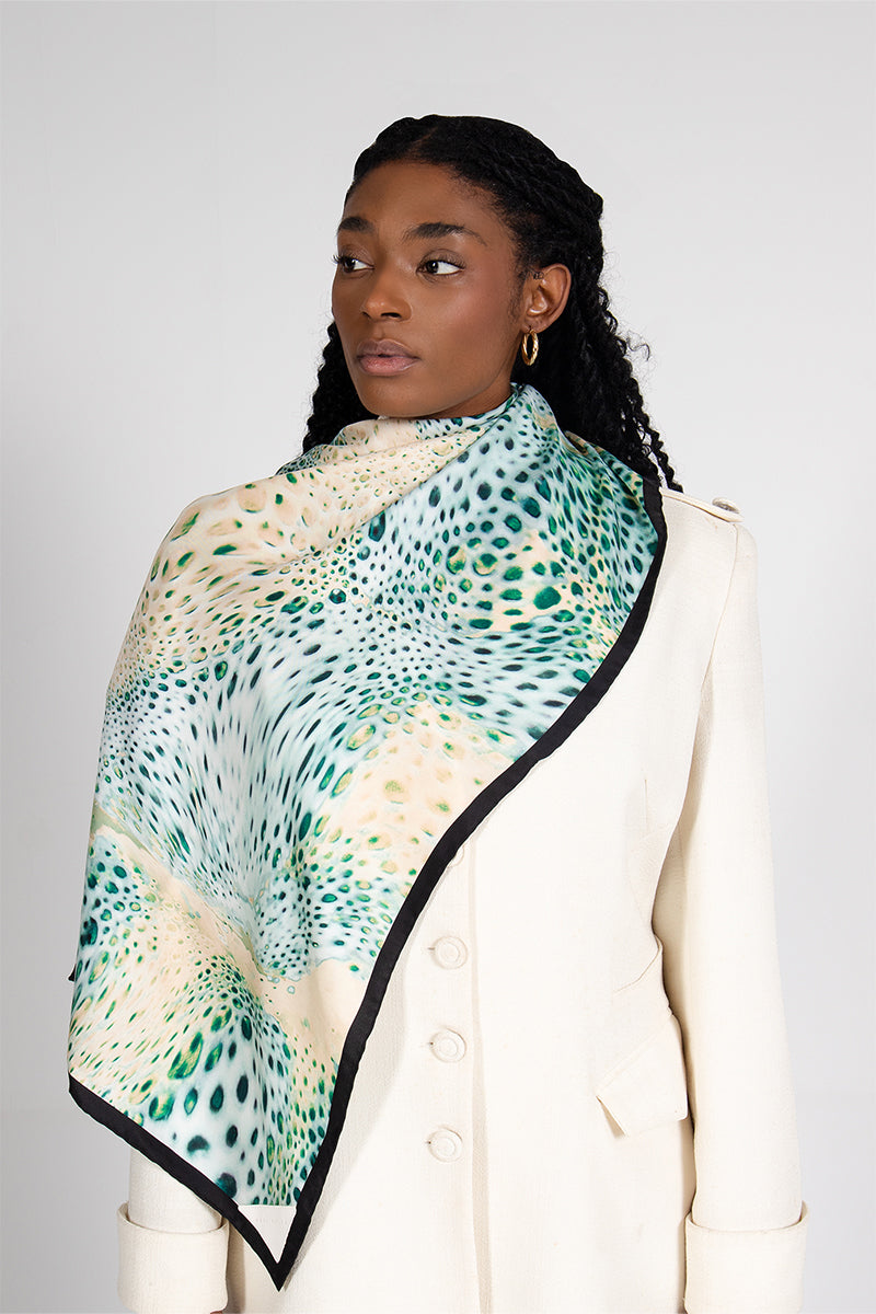 Creamy Moussard silk scarf by Amel Batita featuring soft, luxurious fabric and elegant drape, displayed on a model.