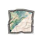 Creamy Moussard blue silk scarf by Amel Batita, lightweight and elegant, featuring a smooth, luxurious fabric with a subtle sheen.