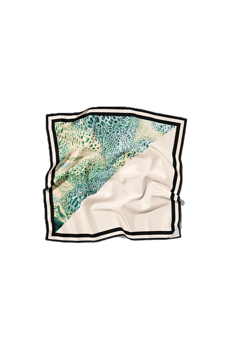 Creamy Moussard silk scarf by Amel Batita featuring a smooth, luxurious blue design with elegant draping and detailed craftsmanship.