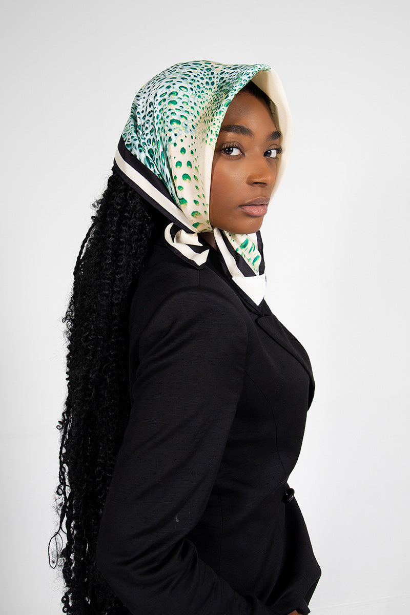 Creamy Moussard silk scarf by Amel Batita featuring a soft, elegant blue fabric suitable for headwear or stylish accessories.