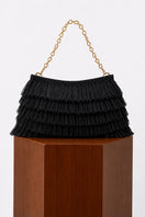Black crochet raffia clutch bag by Folklore The Label, featuring a textured woven design and compact style.