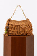 Natural crochet raffia clutch bag from Folklore The Label, featuring a woven texture and compact design for casual or stylish use.