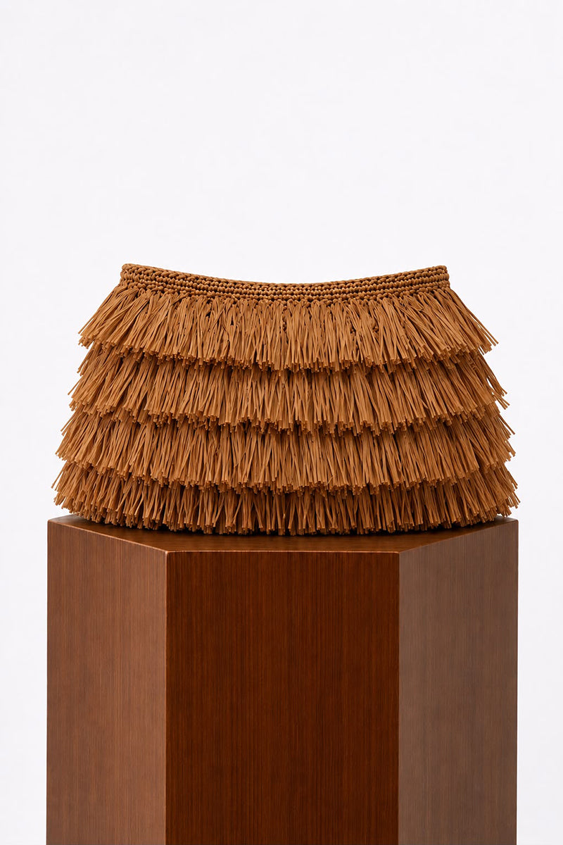 Natural crochet raffia clutch bag by Folklore The Label, featuring a woven design and compact size, perfect for casual outings.