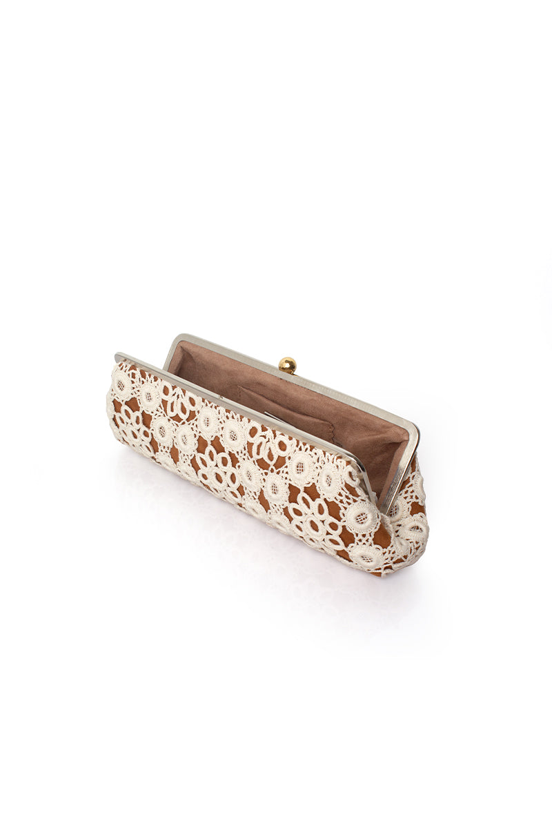 Sarah's Bag crochet Havane clutch bag with long strap, featuring intricate crochet design and textured fabric.