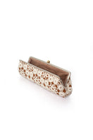 Sarah's Bag crochet Havane clutch bag with long strap, featuring intricate crochet detailing and a stylish, compact design.