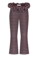 Brown polka dot Capri pants by Stolen Stores featuring a relaxed fit and stylish design, perfect for casual wear.