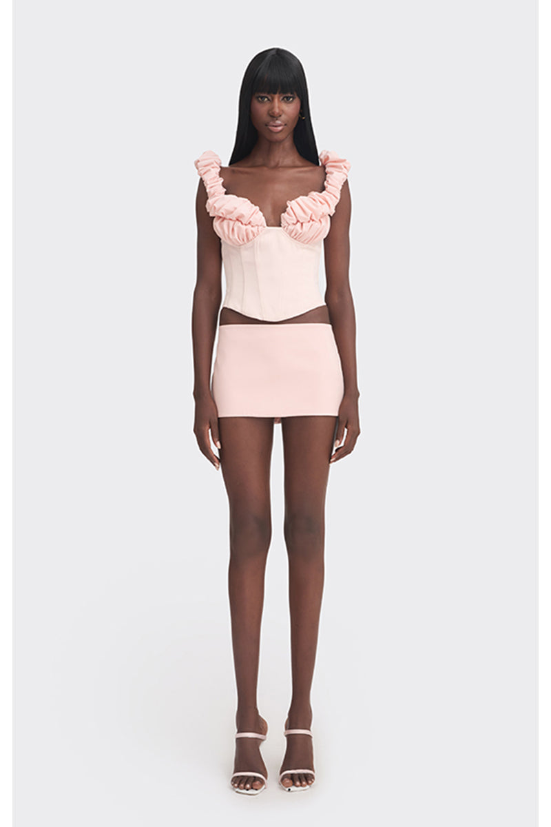 Pink croissant corset bustier top by Stolen Stores, featuring fitted design and stylish details, ideal for trendy fashion outfits.