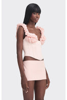 Pink croissant-shaped corset bustier top from Stolen Stores featuring a stylish, form-fitting design in soft pink fabric.