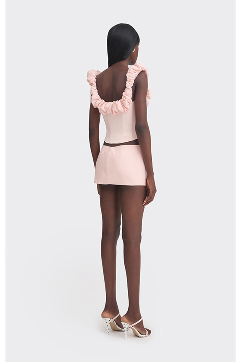 Pink croissant-shaped bustier top by Stolen Stores, stylish corset design with structured fit and feminine detailing.