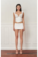 Off-white croissant corset bustier top by Stolen Stores featuring a fitted design and stylish detailing.