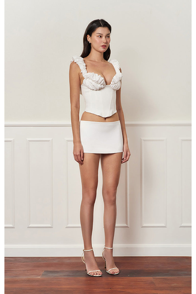 Off-white croissant corset bustier top by Stolen Stores, featuring a fitted design with structured bust and stylish details.
