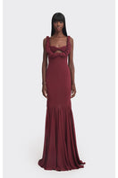 Elegant burgundy maxi slip dress from Stolen Stores featuring a flowing silhouette and subtle croissant-inspired design details.