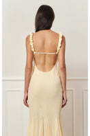 Light yellow maxi slip dress by Stolen Stores featuring a relaxed fit and elegant style, shown on a model.