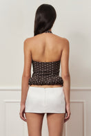 Dark brown mini croissant top with polka dot pattern from Stolen Stores, casual sleeveless top for everyday wear.