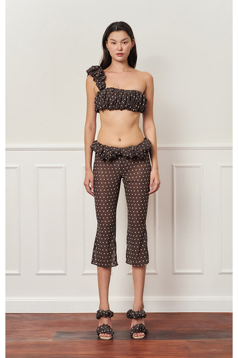 Brown polka dot one-shoulder top by Stolen Stores, featuring a stylish croissant neckline and lightweight fabric.