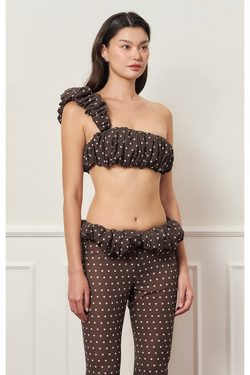 Brown polka dot Croissant one-shoulder top by Stolen Stores, featuring a stylish asymmetrical design and lightweight fabric.
