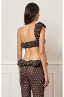 Brown polka dot one-shoulder top from Stolen Stores featuring a stylish croissant neckline and trendy design.