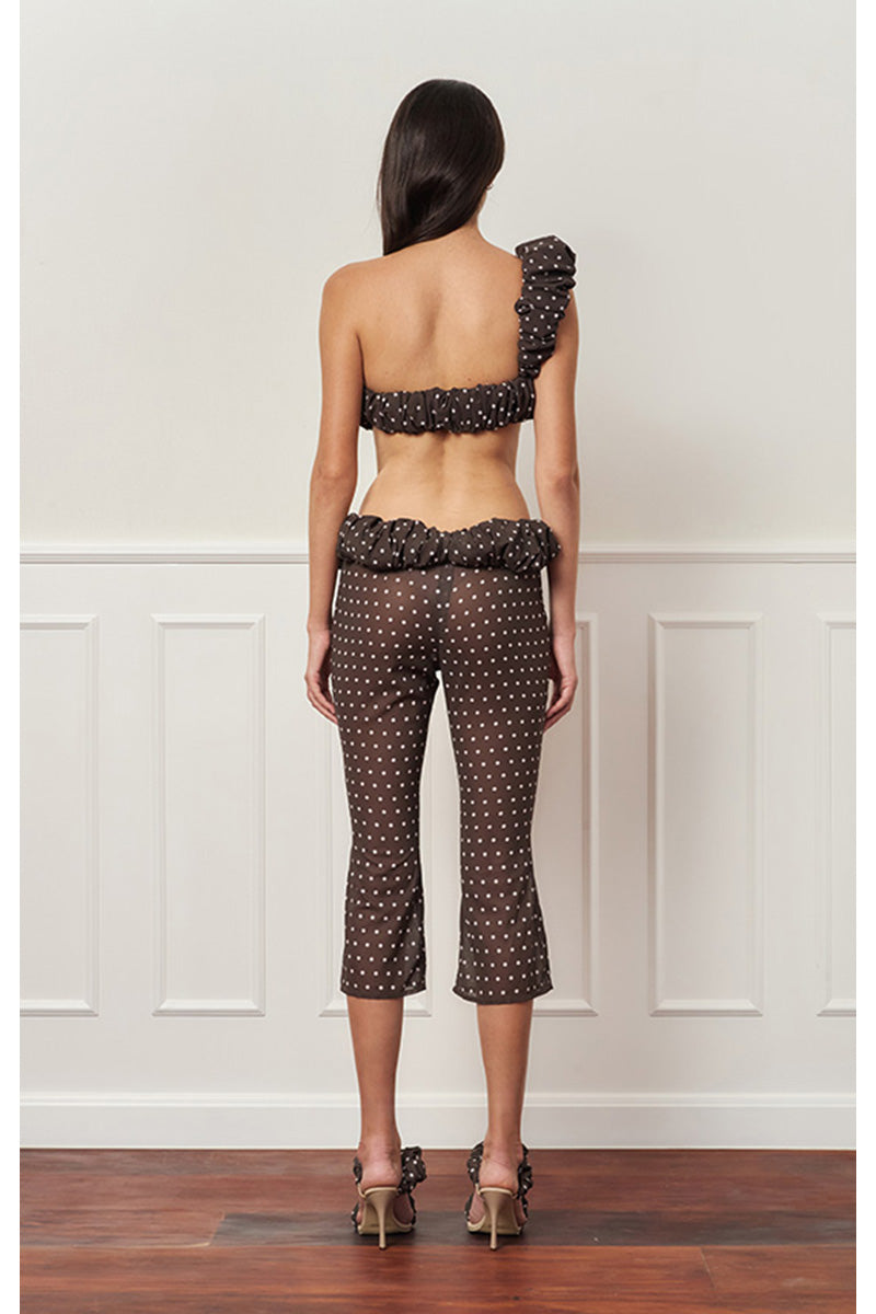 Brown polka dot one-shoulder top by Stolen Stores featuring a stylish croissant neckline and relaxed fit.