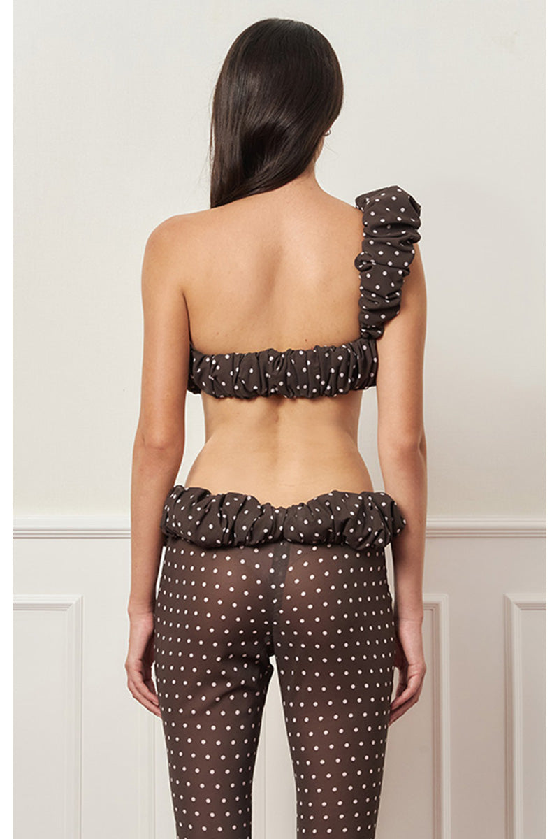 Brown polka dot one-shoulder top from Stolen Stores, featuring a stylish croissant neckline and casual fit.