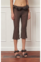 Brown polka dot Croissant Capri pants by Stolen Stores, featuring a stylish, relaxed fit with a playful pattern.