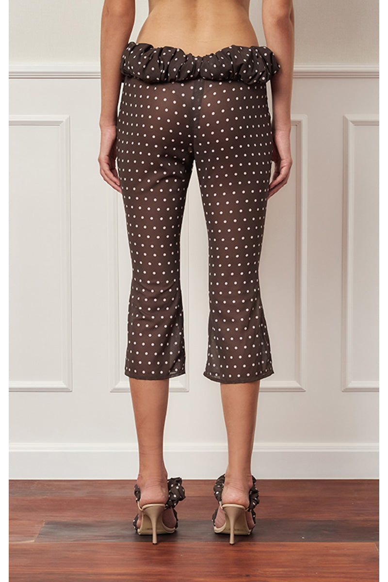 Brown polka dot croissant capri pants by Stolen Stores, stylish and comfortable women's pants with a playful pattern.