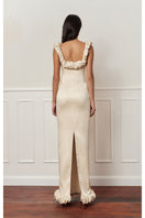 Beige croissant corset maxi dress from Stolen Stores, featuring fitted bodice and flowing skirt, stylish and elegant for special occasions.