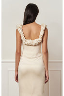 Beige croissant corset maxi dress by Stolen Stores, featuring a fitted bodice and flowing skirt, stylish and elegant for special occasions.